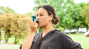 Woman using Airphysio to help with breathing