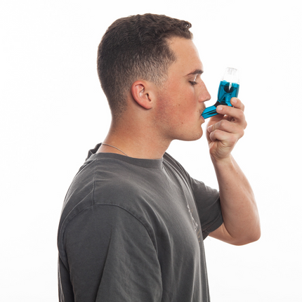 An adult using AirPhysio to improve lung health and clear mucus buildup