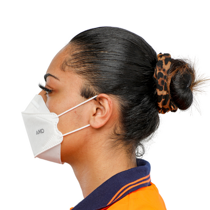 Woman wearing a white AMD P2 respirator with earloops. 3-panel design, natural face contour, secure fit, breathable nano-fiber technology mask.