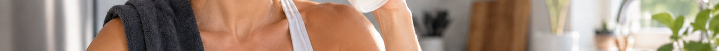 Woman enjoying creatine shake in the kitchen
