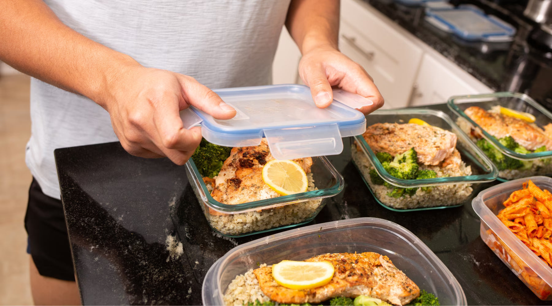 Man doing meal prep to freeze in refrigerator