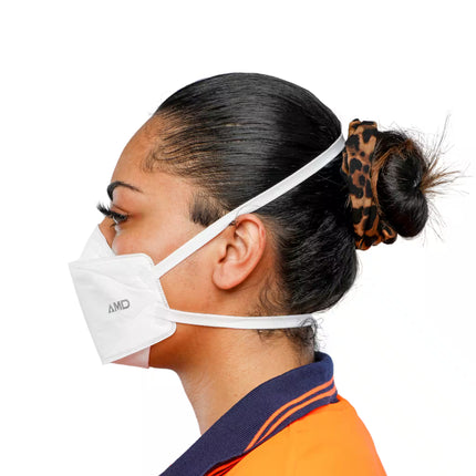 Person wearing a white P2 headband respirator mask with 'AMD' branding, side view