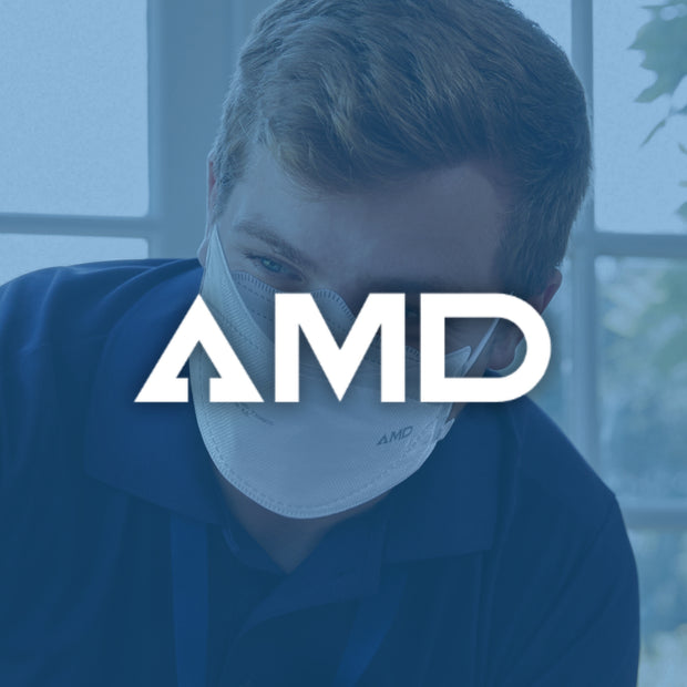 Person wearing an AMD-branded face mask with a blurred background
