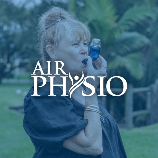 Woman using AirPhysio device with 'AIRPHYSIO' branding in an outdoor setting