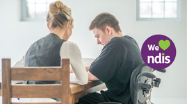 Teacher assisting dyslexic student to study using reader pen