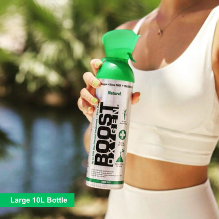 Woman holding Boost Oxygen in a can, large 10L bottle of 95% pure oxygen for fitness recovery, outdoor activities, and energy support