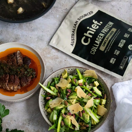 Chief Unflavoured Collagen Protein Powder package with a salad and dish on a table