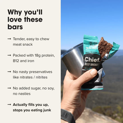Hand holding a Chief Beef Brisket Traditional flavour beef bar with scenic background