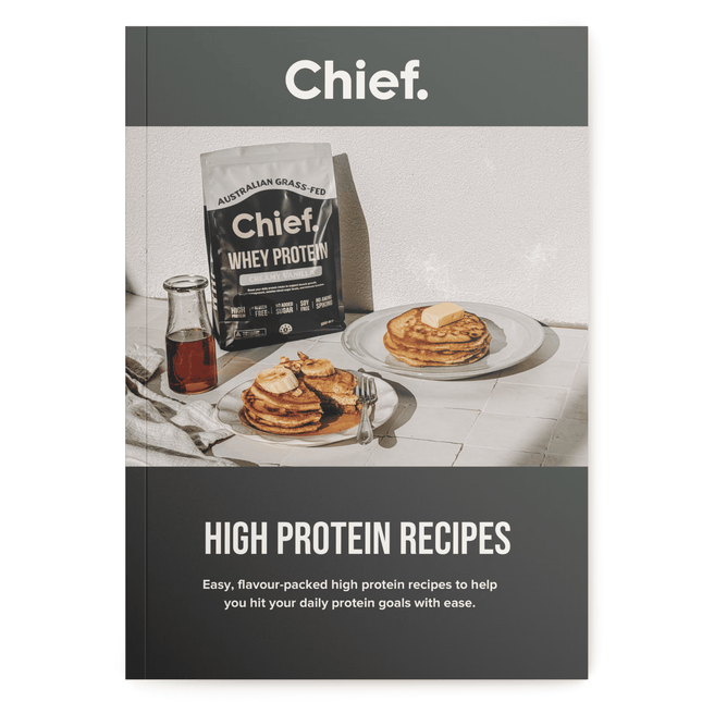 Chief whey protein package with pancakes on a table, featuring high protein recipes.