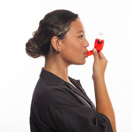 Person using AirPhysio red mucus clearance device for average lung capacity