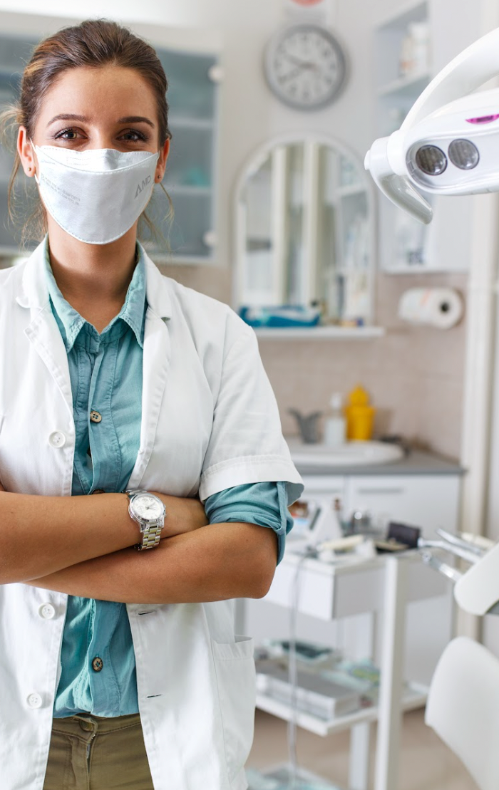 Dentist wearing AMD face mask