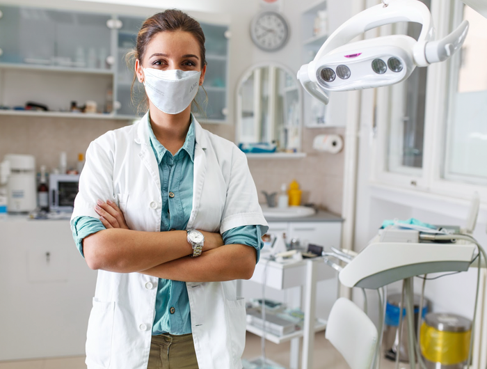Dentist wearing AMD face mask
