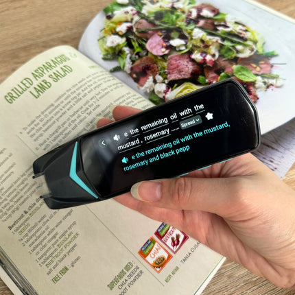 Reader pen scanning and displaying text from a cookbook, helping users easily read and translate recipes