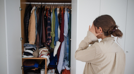 Woman deciding to clean the wardrobe at home due to clothes moths infestation